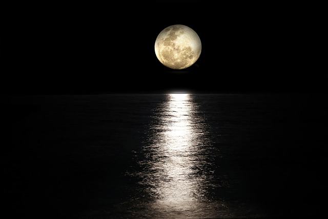  Full Moon Over a Calm Sea