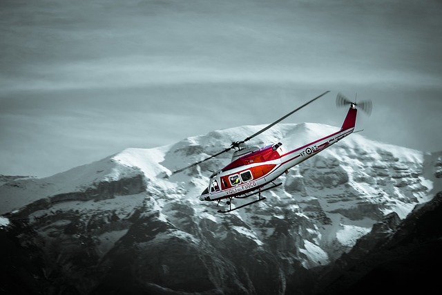 Helicopter landing on a mountain peak