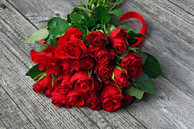 Receiving a bouquet of red roses 