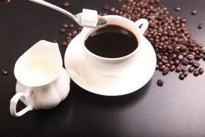 Pouring Sugar into Tea or Coffee