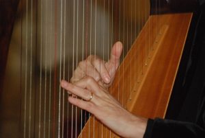 Playing a Harp at a Ceremony